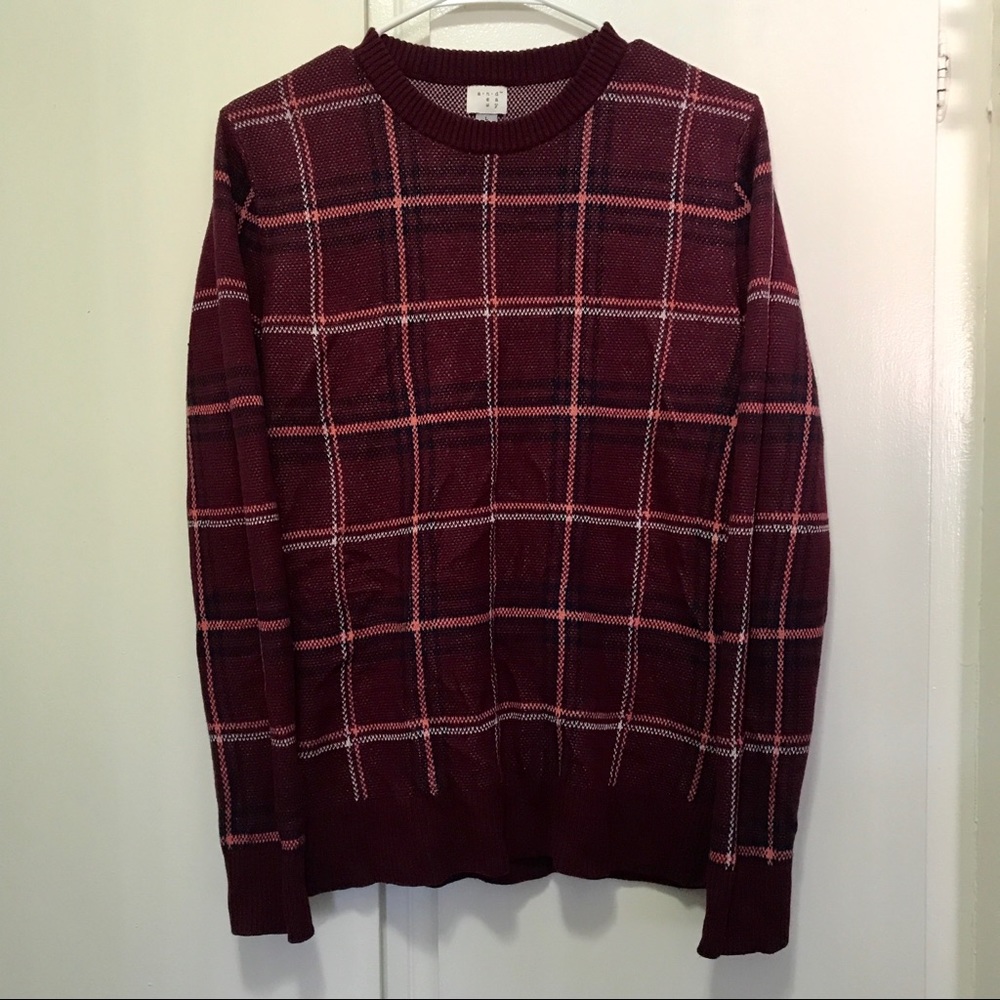 Maroon sweater with stripes.